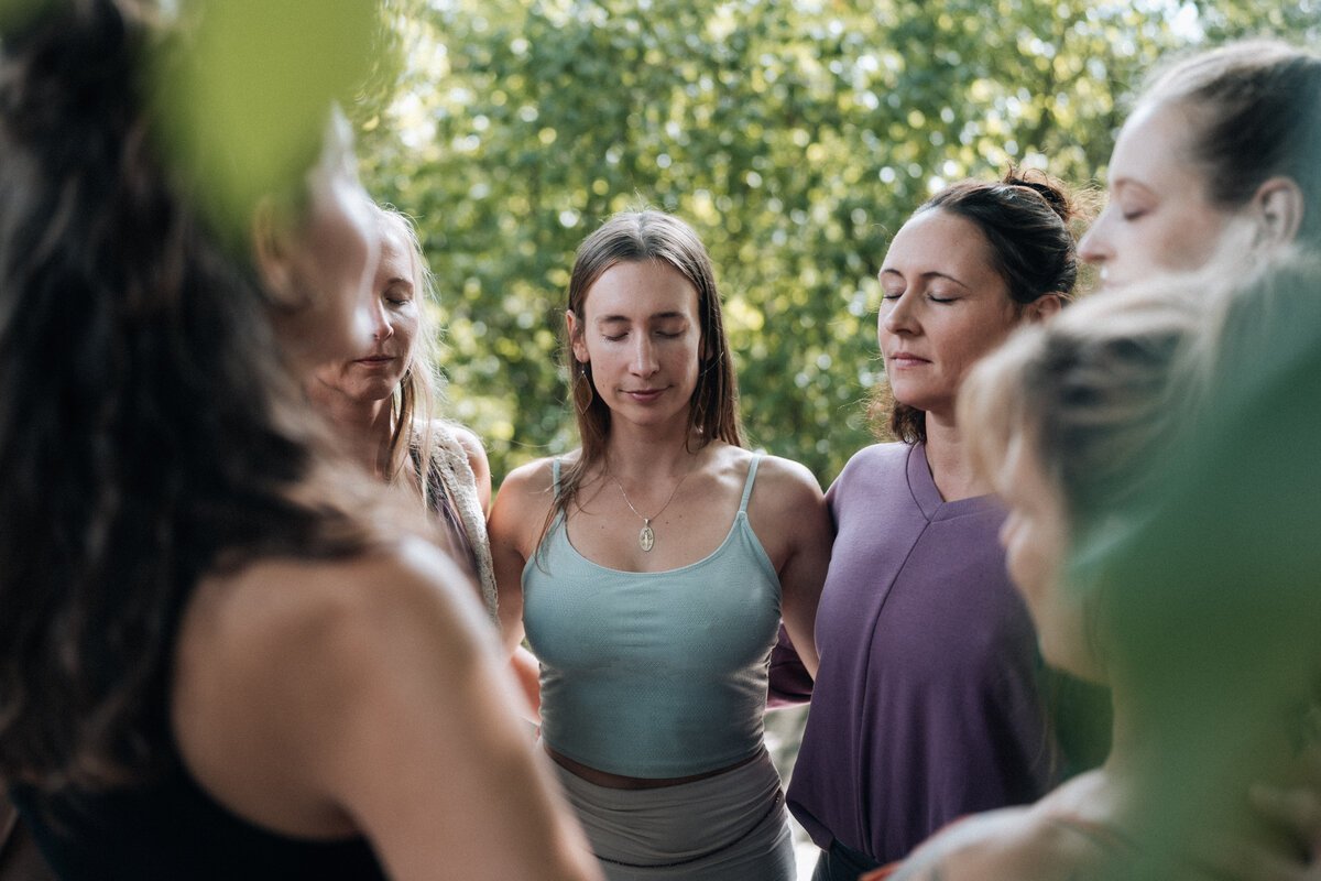 Participants sharing a quiet moment of connection in nature