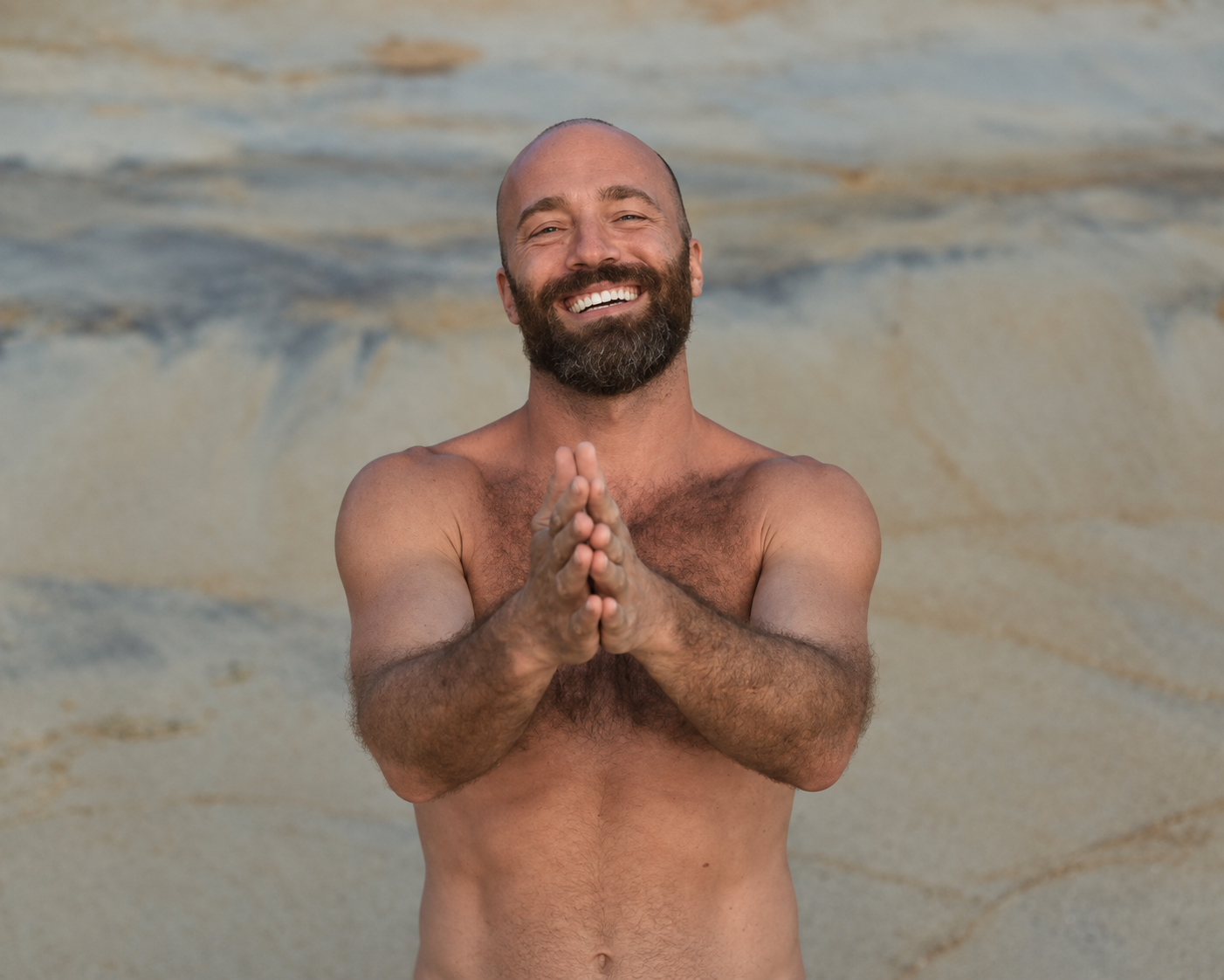 Raphael Mathes smiling with his hands together